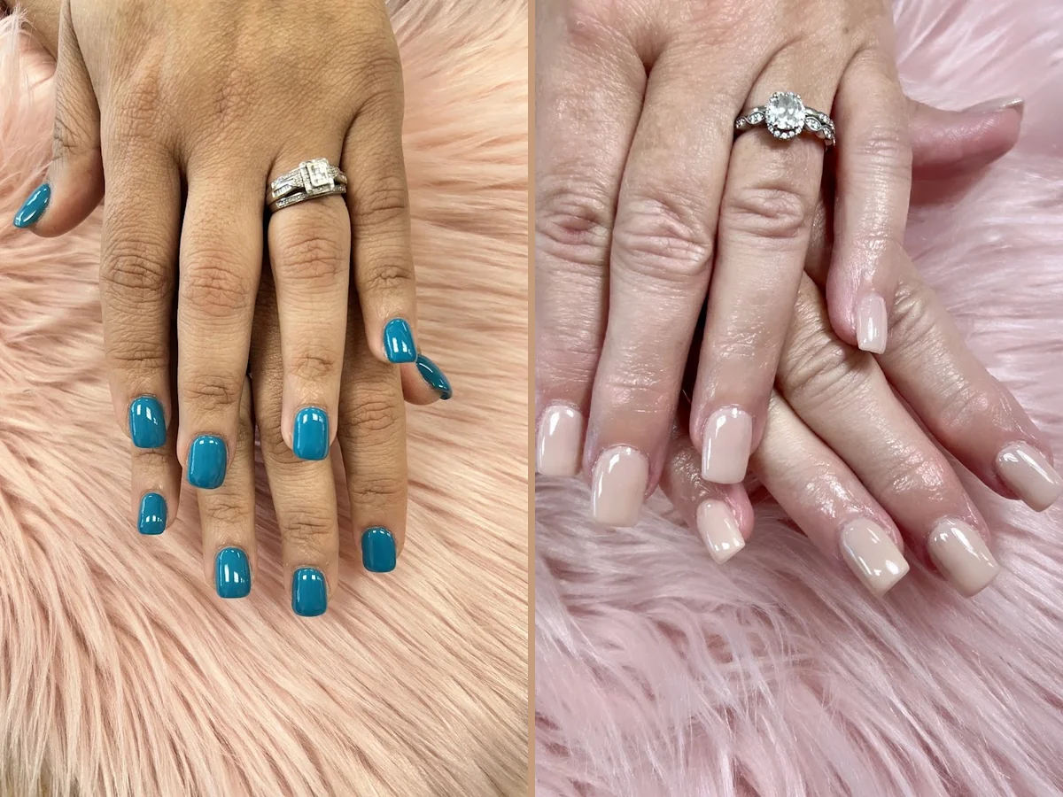 Hands receiving a detailed nail treatment.