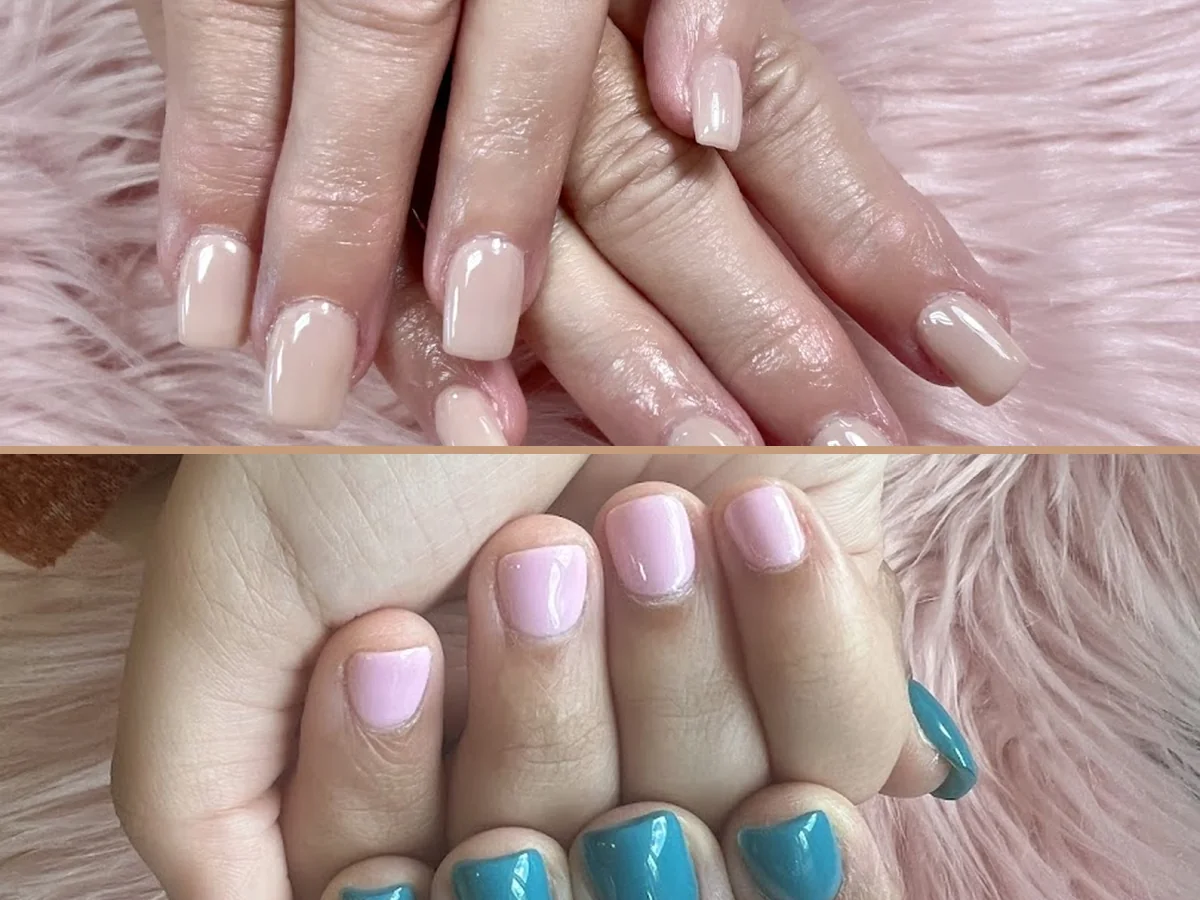 Hands receiving a detailed nail treatment.